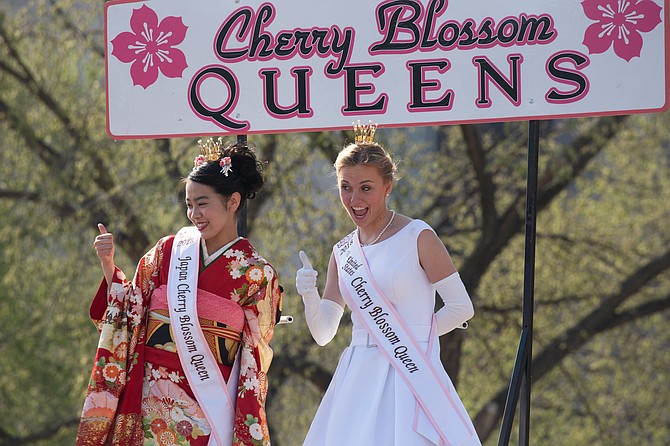 Margaret O’Meara on a parade float with Risako Takenaka, the 2018 Japanese Cherry Blossom Queen.