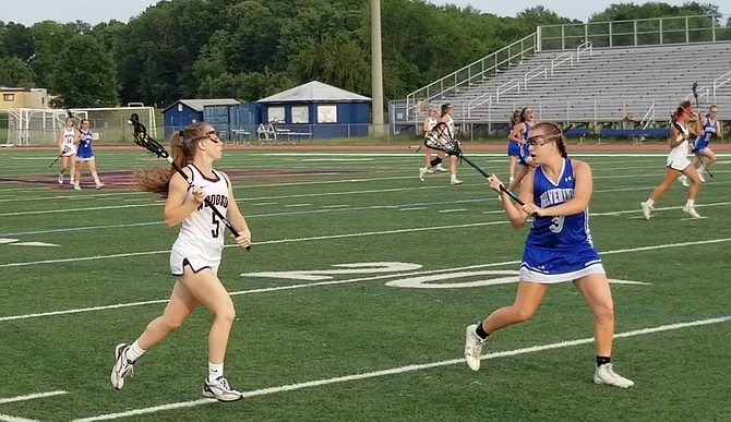 Woodson senior Logan Dougherty, left, scored nine goals and had three assists against West Potomac on Tuesday.