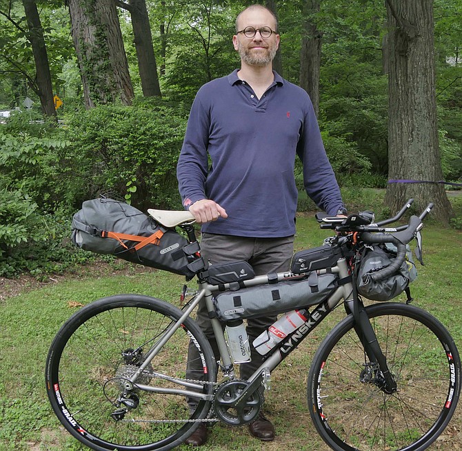 Bruno Dedet has his bike outfitted for the Trans America Bike Race which began June 2 in Astoria, Ore.
