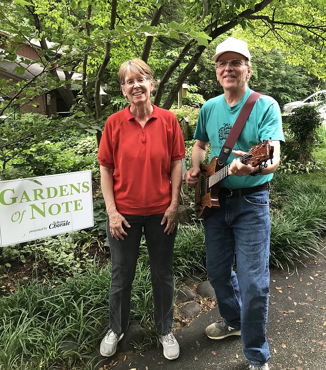 Ellen Torzilli and her husband Al, of the Reston Chorale, entertain garden visitors at the Bitzer garden during the Second Annual Gardens of Note presented by the Chorale.