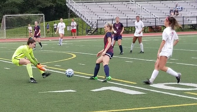 Goalkeeper Jordan Silkowitz, left, and the Woodson girls’ soccer team shut out T.C. Williams in the region semifinals on May 30.
