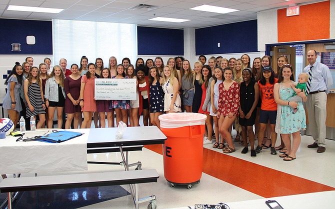 The West Springfield Varsity Girls' Soccer Team pictured with their $500 Sportsmanship Challenge reward from BenGlassLaw.