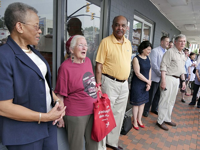 Greg Embree, member of Cherrydale 125 Committee, is joined by Ethelene Crockett Jones, Joan Trumpauer Mulholland, and Dion Diamond, all three participants in the June 9 1960 lunch counter sit-in in Cherrydale. On the right behind Embree are state Sen. Barbara Favola and Del. Patrick Hope.