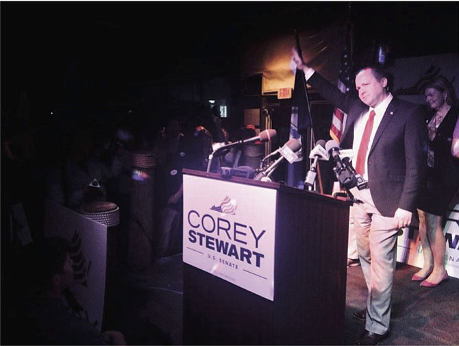 Prince William County Board of Supervisors Chairman Corey Stewart claims victory during a victory party in Woodbridge, where supporters chanted "build the wall” and “lock her up."