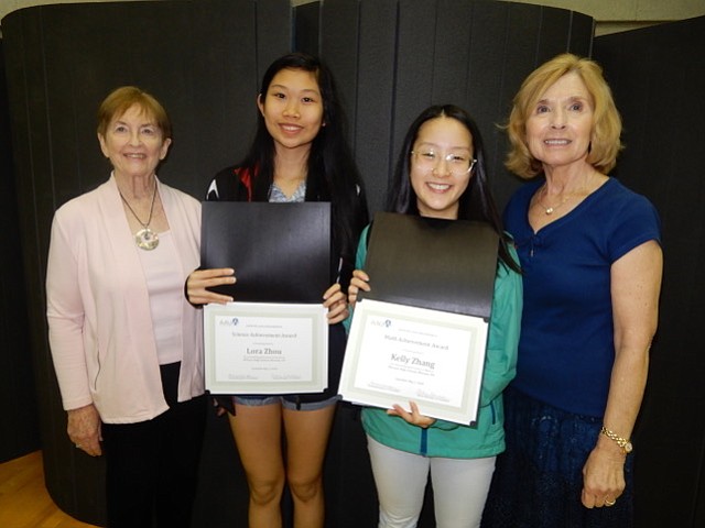 Lora Zhou, second from left, and Kelly Zhang, second from right, juniors at McLean High School are shown receiving their academic achievement awards from the McLean Area Branch of AAUW. The awards were presented by Caroline Pickens, far left, AAUW of VA Northern District Co-Representative, and Myrtle Hendricks-Corrales, far right, branch liaison for McLean High School.