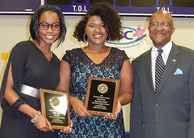 Among the high-school Humanitarian Award winners are (from left) Melanie Wendo and Hannah Washington with Johnny Nelson. (Not pictured are Mya Baptiste, Derrian Brown and Tagwa Shammet).
