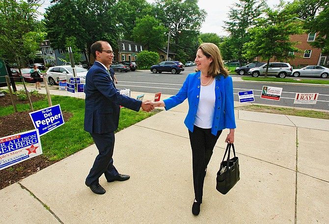 Mayor Allison Silberberg and her opponent Vice Mayor Justin Wilson shake hands in passing at the Mount Vernon Recreation Center just before the polls closed on the day of the Democratic primary, June 12.