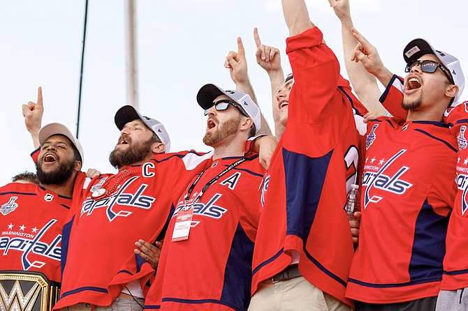 Washington Capitals team members celebrate their Stanley Cup victory at the June 12 rally.