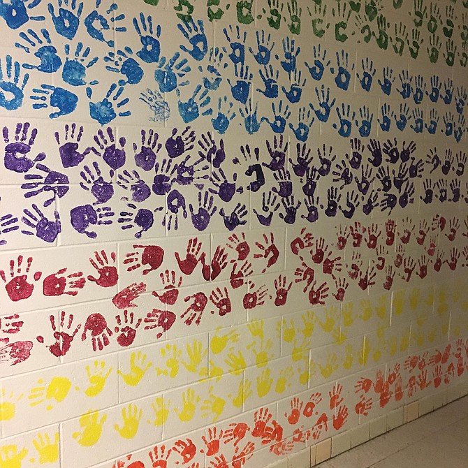 Students from each grade level left their hand prints on the wall at Potomac Elementary School.