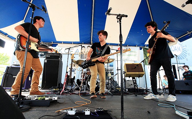 The Rock Of Ages Music school in Del Ray held ROAMstock '18, and featured 24 of its student bands in the parking lot at 114 E. Del Ray Avenue on June 9 from noon to 8 p.m. ROAM, which opened its doors to music students ages 10 and up in 2011, also hosts the annual ROAMfest at the Birchmere every winter. From left: Nathan Hugeley, 17; Alec Stamatopoulos, 16; and Patrick Kenny, 14, of the band Big Guy. 