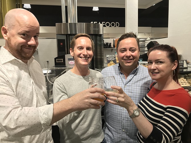 Daniel and Jennifer Griffin, and Vincent Grady and Barrett Tucker, prepare to have a little fun at the Grand Opening of Balducci's Food Lover's Market in Reston held June 22.
