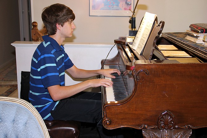 Jonathan Schwartz practices piano during his senior year of high school.