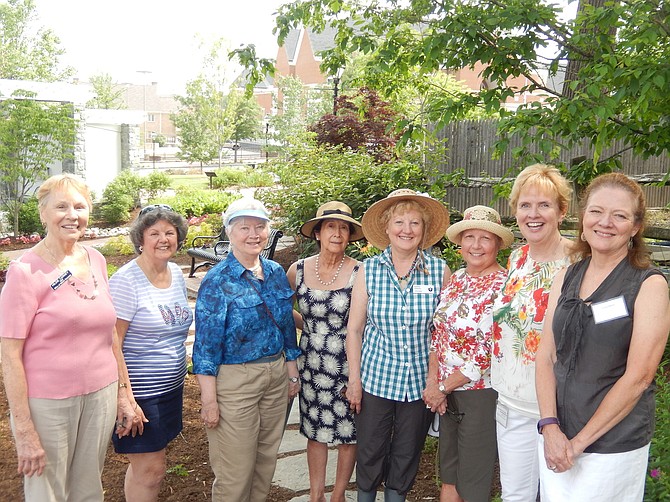 In Kitty Pozer’s garden are Fairfax Ferns Garden Club members (from left) Hildie Carney, Ginny Warren, Mary Ellen Alden, Mary Villa McLaughlin, Karin Rindal, Mariann Kowalski, President Eileen Tumelty and Justine Harris.
