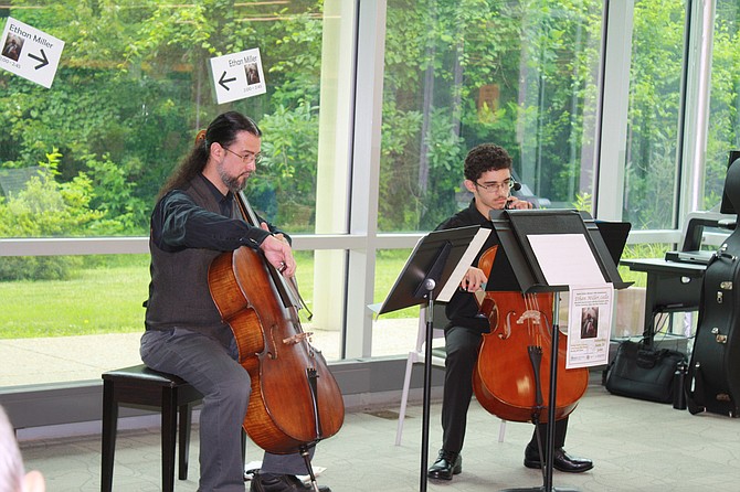 Music teacher Ethan Miller had students from Oakview Elementary School and Robinson Secondary School playing music on violins and a viola.