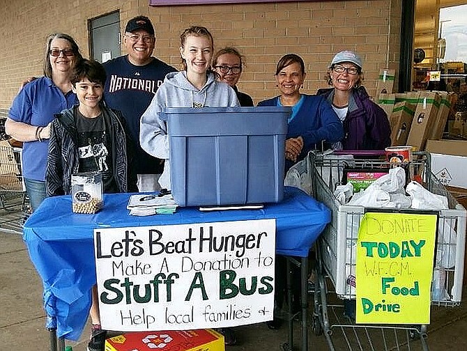 A WFCM food drive held last year outside the Giant food store in Centrewood Plaza. Pictured are volunteers from Centreville United Methodist Church; their efforts were spearheaded by Chris and Patricia Granberg and their daughters, Caitlyn and Abby.