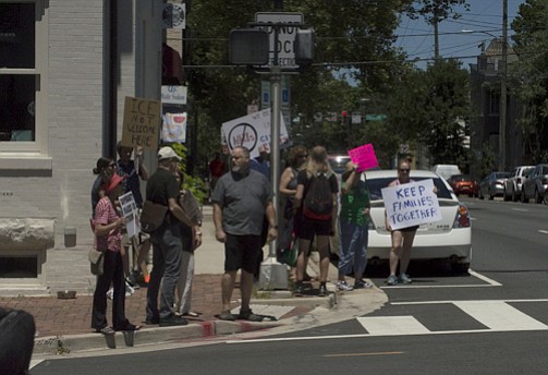 Protesters in the corner of KIng and South Patrick streets.