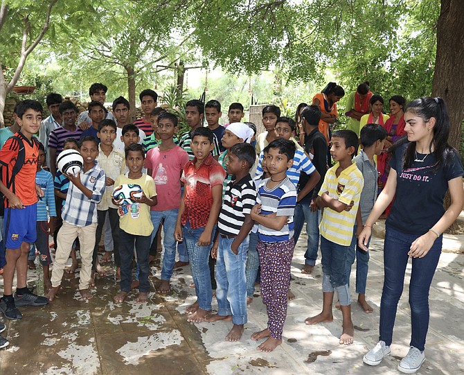 Twelve-year-old Kushaan Saran, left, and 14-year-old Medhnaa Saran, right, have been visiting the Bal Ashram every year for six years. Their next visit will be this August.