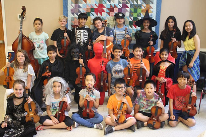 Group photo of the musicians at Summer Strings. All rising fourth through sixth grade musicians attend Spring Hill Elementary School. 
