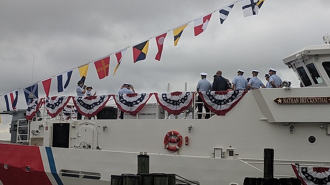 Dignitaries and crew of the USCGC Nathan Bruckenthal stand on deck prior to the start of the Coast Guard commissioning ceremony July 25 at the Alexandria waterfront.
