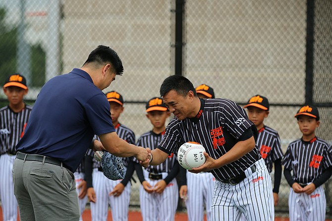 Managers exchanging pre-game gifts.