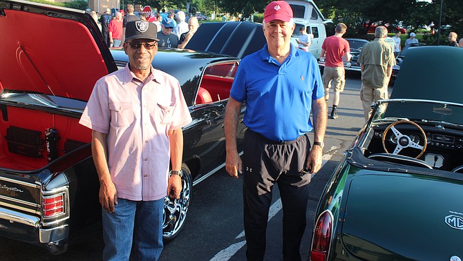 Percy Alexander, left, of Aldie and Joe Dowley of McLean stand with their cars. “This was my bucket list car,” Alexander said. Dowley has two MGs. “If I could clone myself, I’d bring them both,” Dowley said.