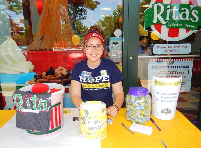 Fairfax High grad Kelly Salguero collects donations outside Rita’s Italian Ice.