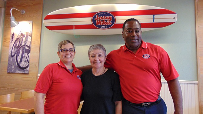 Jersey Mike’s owners Tracey (left) and Maurice Jennings, with Linda Patterson of Lorton Community Action Center.
