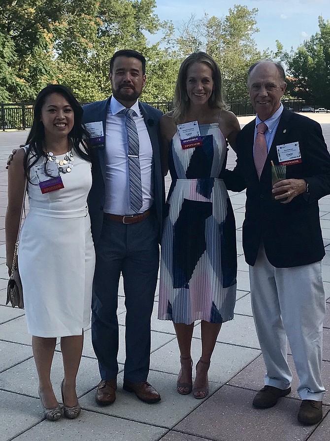 Alexandria Rotary Club president Paul Anderson, right, poses for a photo with the organization’s 40 Under 40 honorees July 19 at United Way Worldwide headquarters. With him from left are Anh Nguyen, Ru Toyama and Christine Friedberg.
