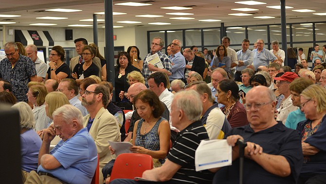 Having their say: Several hundred attended the public meeting to discuss the VDOT proposal to test closures on the Georgetown Pike ramp to I-495. Many came prepared to make comments and lined up to do so.