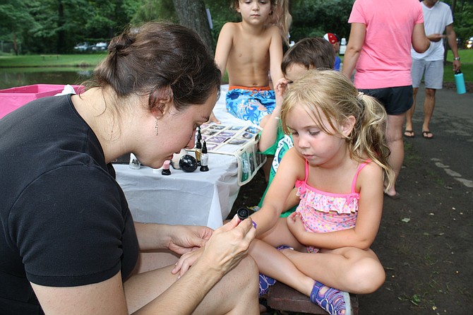 Callahan O'Brien gets a tattoo on National Night Out from tattoo artist Pamela Outwin.