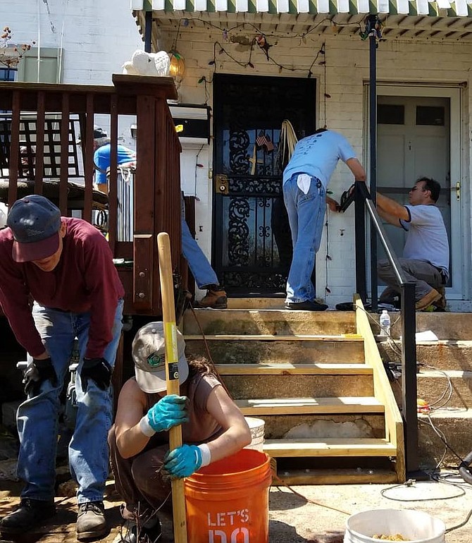 Dwaine and other volunteers at Mrs. P’s home on National Rebuilding Day in April.