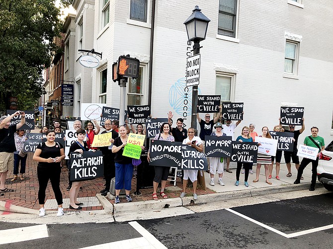 Protestors with Grassroots Alexandria and Christ Episcopal Church outside the former home of white nationalist Richard Spencer in Old Town. The group protested outside the second floor residence twice a month for a year-and-a-half. 