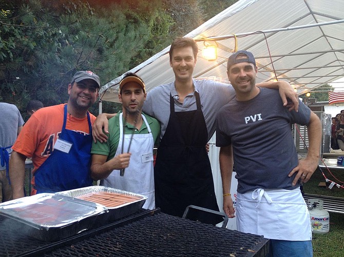 Manning the grill last year at Holy Transfiguration’s Middle Eastern Food Festival are, from left:  Robert Salem, Omar Samaha, Marks Brubaker and Matt Leiva.