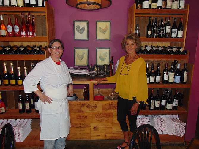 Chef-owner Caroline Ross with bartender Kathy Coombs in the dining room of the River Bend Bistro & Wine Bar.