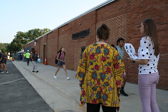 West Springfield teachers monitor as students file in on the first day of school.