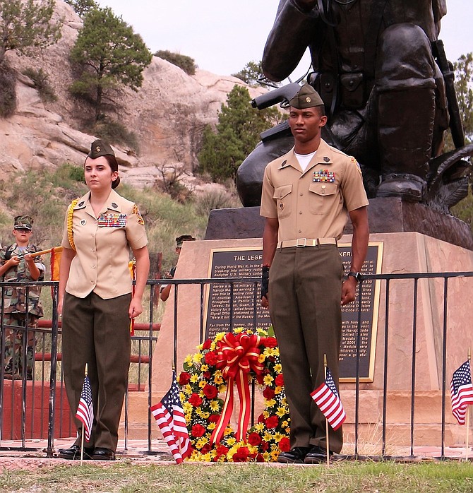 Young Marine SgtMaj Lauren Loria, of Fairfax, national Young Marine of the year, and YM MGySgt Tyson Henry perform a wreath laying ceremony to honor Navajo Code Talkers in Window Rock, Arizona.
