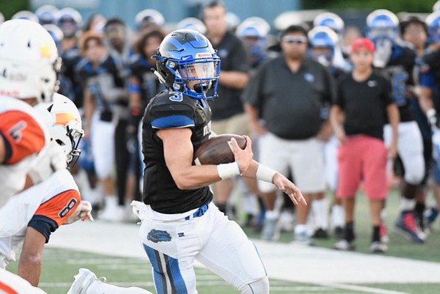 West Potomac quarterback JT Mayo passed for 263 yards and a touchdown and rushed for 109 yards and another touchdown against Briar Woods on Aug. 24.