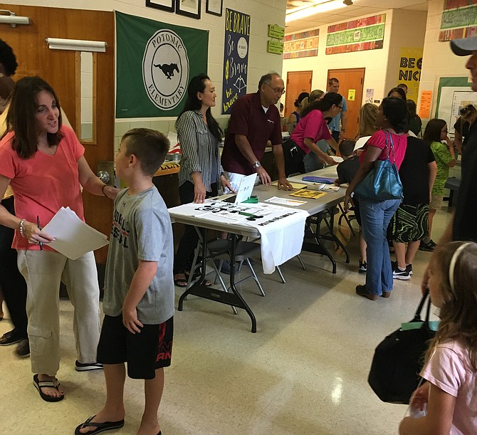 Faculty and Staff of Potomac Elementary School greet students and parents at the school’s Open House. Potomac Elementary will be housed at the old Radnor Elementary School in Bethesda during the construction of a new school in Potomac.