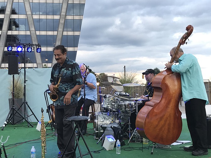As a light breeze blew, Rick Whitehead- guitar, Barry Hart-drums, John Previti- bass and Chris Vadala- sax performed at the last concert of the 2018  'Summerbration' series held at the open-air Civic Plaza atop the Wiehle-Reston East Metro Station on Friday evening, Aug. 31.