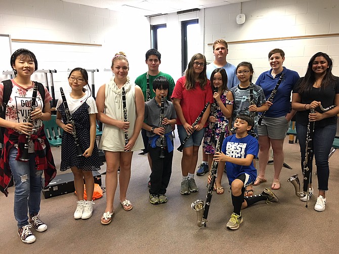 Members of a clarinet sectional pose with teacher Carrie Fessner (second from right) after their class is done.
