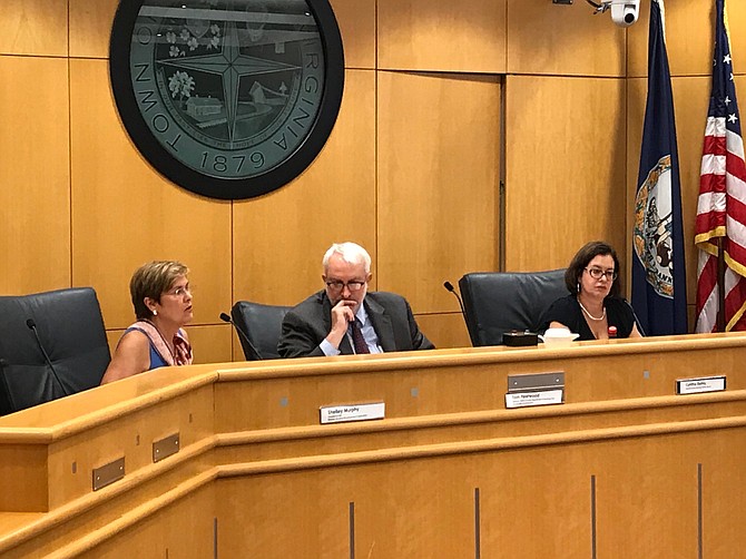 From left, Shelley Murphy, CEO Wesley Housing Development Corporation, Tom Fleetwood, Director of the Department of Housing and Community Development Fairfax County and Cynthia Bailey, Deputy County Attorney Fairfax County provide remarks at the Town of Herndon's Planning Commission.