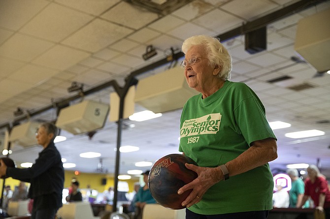 Ninety-three-year-old Marge McNare from Fairfax prepares to bowl in game one of the 2018 Northern Virginia Senior Olympics at Bowl America Shirley in Alexandria on Sept. 17.  McNare enjoys bowling twice a week in a Falls Church league.
