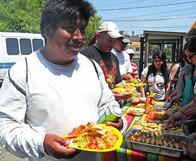 SEEC workers are served lunch by local church youth while waiting for potential temporary employment.