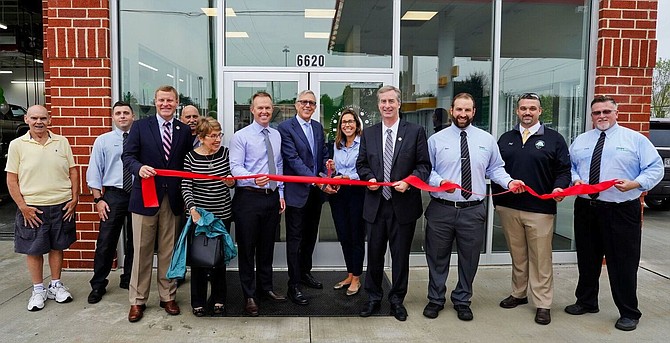 From left: Bobby Johnson (retired from Virginia Tire & Auto), Dan Viteri,  Supervisor Jeffrey C. McKay (Lee), Jimmy Himes, Carole Boncarosky, Mike Holmes, Myron Boncarosky, Julie Holmes, Del. David Bulova, and Ben Wilson, Jeff Trump, and Chris Branch.