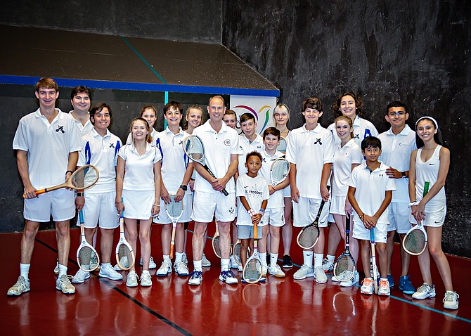 His Royal Highness Prince Edward [center] stands with the young Prince’s Court Tennis players from McLean Sport & Health Club. Court Tennis is the original racquet sport from which the modern game of tennis is derived.