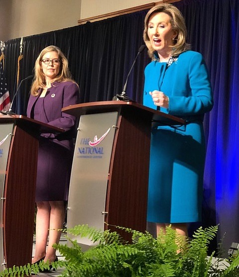 U.S. Rep. Barbara Comstock (R-10) responds to questions from Loudoun County Chamber of Commerce panelists during a 90-minute debate Sept. 21 at the National Conference Center in Leesburg, while her challenger, state Sen. Jennifer Wexton (D-33) looks on.