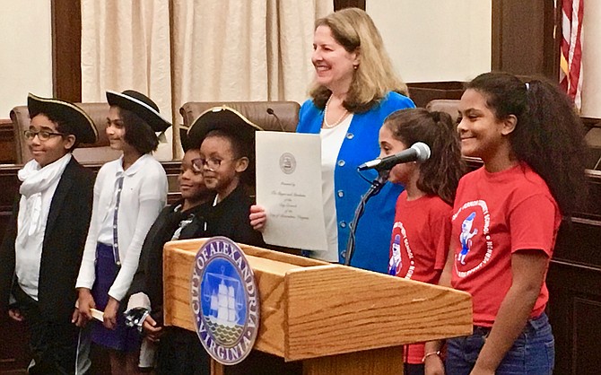 Mayor Allison Silberberg and ACPS students show off a local proclamation commemorating the 231st anniversary of the U.S. Constitution’s signing.