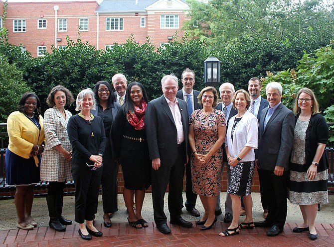 From left: Monica Jefferson, Housing Opportunities Made Equal (HOME); Heather Crislip, (HOME); Jennifer Endo, AHC Inc.; Lynn Thomas, Community Lodgings; Kim Hart, Good Works; Sylisa Lambert-Woodward, Pathway Homes; U.S. Sen. Tim Kaine; John Welsh, AHC Inc.; Michelle Krocker, Northern Virginia Affordable Housing Alliance; Walter D. Webdale, AHC Inc.; Nina Janopaul, APAH; Nick Bracco, The Michaels Organization; Bobby Rozen, Washington Council Ernst & Young (retired); and Michelle Winters, Alliance for Housing Solutions.

