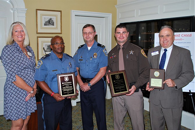 Shandra Niswander with awardees and Chief Jay Farr.