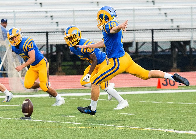 Kicking off the football game, Robinson Senior Jacob Haynie hopes to score as many points as he can to reach his goal of donations for Alex’s Lemonade Stand, an organization for pediatric cancer. 